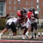 Sophomore running back Keyon Butler powers through Emporia State defenders