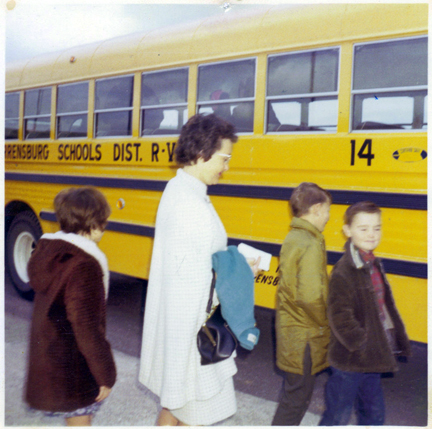 (Courtesy photo) Lisa’s mother, Elizabeth Irle, escorts children onto a bus for what Lisa thinks was a field trip.