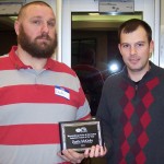 (Courtesy photo) Dustin McKinley (left) receiving a plaque for Volunteer Coach of the Year from Recreation Supervisor Matt Clawson (right).