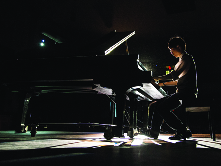 Chinese student Jiawei (William) Tsai plays a piece by a romantic composer on the piano. (Photo by ANDREW MATHER, Photo Editor)