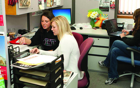 Sadie Hicks, Dani Myers and Kellyn Baysinger work in the Innovative PR office for their client Earth Day 365. The office is a part of University Relations. (Photo by NICHOLAS HALL, for The Muleskinner)