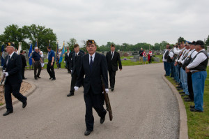 (Photos by Taz Hall, digitalBURG) Members of the American Legion, along with representatives from all branches of the military, gather at Sunset Hill Cemetery on Colburn Road Monday morning for Memorial Day services. The gathering was lead by Alex Slocum, commander of the Warrensburg American Legion; Bryan Lee, commander of VFW; and Keith Lawrence, who lead the group in a prayer as American Legion chaplin.