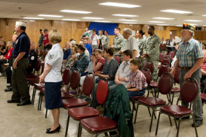 Veterans stand to be recognized at the American Legion building on Young Street. The ceremony took place after being relocated from the Johnson County Courthouse on Holden Street.