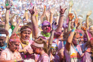 (Photos by Andrew Mather, digitalBURG) The runners, plastered in a rainbow of colors, dance and cheer during the color celebration at the main stage.