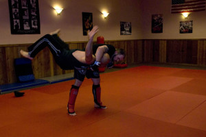 (Photos by Kaitlin Becker) Denton Matheny, 24, does an MMA move called a hip throw to toss his father, Billy, 47, to the mat during their practice at Warrior Jujitsu Monday, June 3. The facility is located at 121 E. Pine St. in Warrensburg. Denton trains to fight in MMA tournaments.