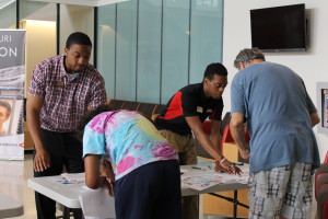 Photo by NICOLE COOKE, digitalBURG. Rodney Lindsey, left, and Darryl Rutt were some of the UCM staff members that helped distribute tickets Monday morning for President Barack Obama's speech Wednesday. Tickets were sold out shortly after 11 a.m.