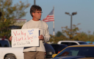 Protestor Randy Higgins holds his sign in opposition to the government shutdown. Photo courtesy of Michael Bersin/Show Me Progress