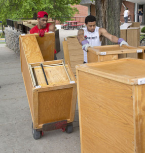 Mules football players Tevin Teamer, left, and Diaron Rhodes help load old furniture from South Yeater Hall on a truck to be shipped to an orphanage in Afghanistan. 