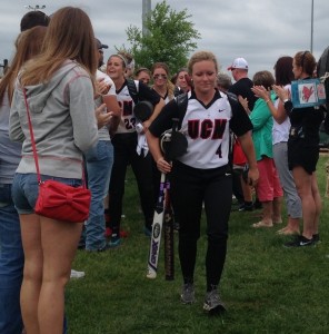 Photo by Alex Agueros Sophomore Alex Leonhart (4) and the Jennies softball team walks to the South Recreation clubhouse among cheering fans and parents after their 2-0 victory over Henderson State. Leonhart had the game-winning hit, a two-run home run, in the sixth inning.