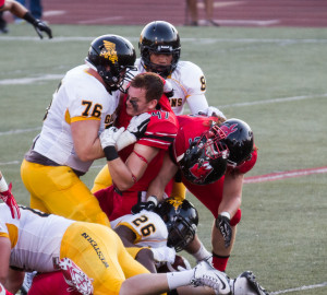 Linebacker Sam Smith loses his helmet while attempting to tackle Missouri Western running back Raphael Spencer.