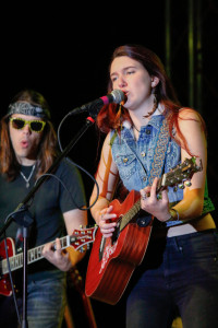 Devon sings and plays the guitar and keyboard at the fall concert sponsored by Spotlight on Friday.