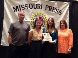 PHOTO SUBMITTED BY NICOLE COOKE Nicole Cooke, third from left, poses with her family during an awards luncheon Saturday with a plaque after receiving the 2015 William E. James Outstanding Young Journalist of the Year award at the Missouri Press Association Convention in Columbia, Missouri. From left, her family is father, Randy; younger sister, Laura; and mother, Ann.