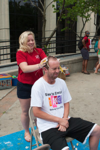 Nick Zahner, a senior safety management major, cringes as Kati McKenzie, an education major, cracks a couple of eggs on his head.