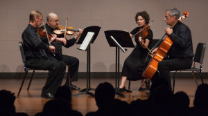 From left, performing a string quartet, John Rutland on violin, Steve Wasko on violin, Carrie Turner on viola and Mike Bersin on cello fill the halls with their energetic performance.