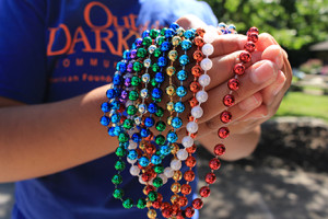 Multi-colored "honor beads" are used to signify specific loss and struggle of an individual person.