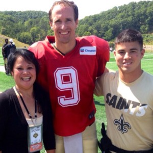 PHOTO VIA MATTHEW GOOD'S INSTAGRAM ACCOUNT From left, Norie Good, Drew Brees and Matthew Good pose for a photo at the New Orleans Saints training camp. Matthew interned with the Saints this summer as an athletic trainer.