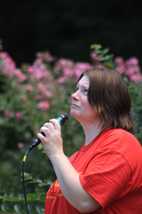 April Roller, chair of the Out of the Darkness Community Walk in Warrensburg, watches with high hopes as her personal words fly higher and higher to her husband by balloon carrier.