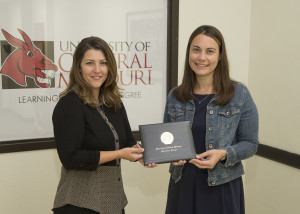 PHOTO SUBMITTED BY UCM PHOTO SERVICES From left, Kelly Waldram Cramer, interim director of marketing and promotion, presents Marcy Bryant with the 13th Foster/Inglish Award for Outstanding Achievement and Service in Public Relations.