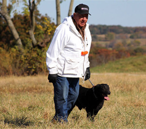 Amateur handler Vern Hasenbank and his Labrador retriever, Dominator Dealer, approach the line for a run during the Kansas City Retriever Club’s field trial Saturday in Sedalia, Missouri. The three-day event consisted of Labrador, golden, and Chesapeake Bay retrievers competing to qualify for runs in amateur, open and derby.