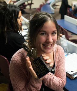 PHOTO BY BRANDON BOWMAN / PHOTO EDITOR Leah Wankum, graduate student of mass communication and managing editor of the Muleskinner/digitalBURG, shows off her bust of Walter Cronkite, which she received as an award when her academic paper was accepted at the second annual Walter Cronkite Conference on Media Ethics and Integrity on Monday at Missouri Western State University.