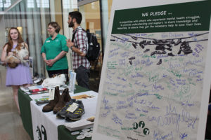 PHOTO BY ANDREA LOPEZ / MULTIMEDIA EDITOR A New Jersey based organization called Attitudes in Reverse presented an exhibit in the Student Recreation and Wellness Center Tuesday afternoon to raise awareness of mental health and suicide prevention. 