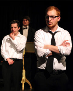 Caleb Gazaway, right, plays the father during “Lot 13: The Bone Violin” at the Department of Theatre and Dance’s One-Acts in Nickerson BlackBox. Nate Weber, center, plays the professor; Chris Scott, background, plays the auctioneer.