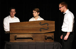 Caleb Gazaway, right, stars as the father morning over his lost child during “Lot 13: The Bone Violin” at the Department of Theatre and Dance’s One-Acts in Nickerson BlackBox. Leah Eggiman, center, plays the doctor; Nate Weber, left, plays the professor.