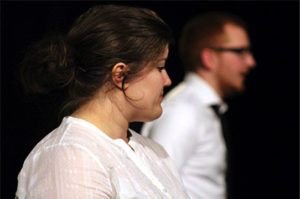 Kaelynn Whitt, playing the mother, pauses from discussion during “Lot 13: The Bone Violin” at the Department of Theatre and Dance’s One-Acts in Nickerson BlackBox. Caleb Gazaway, playing the father, speaks in the background.