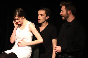 Marisa Perry starring as Alice, left, laughs as she hears her unborn baby speak to her during “Baby Talk” at the Department of Theatre and Dance’s One-Acts in Nickerson BlackBox. Steven Covert, center, plays the baby; Austin Hook, right, plays the husband.