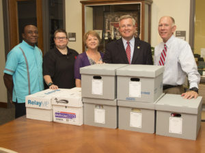 Missouri Sen. David Pearce, second from right, recently delivered the first of many boxes containing his official papers and memorabilia from his career in the Missouri Legislature to the UCM Arthur F. McClure II Archives and University Museum. He met with, from left, Gersham Nelson, dean of the College of Arts, Humanities, and Social Sciences; Amber Clifford, curator of museum collections; Vivian Richardson, archivist and assistant director of the archives and museum; and President Chuck Ambrose.