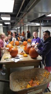 PHOTO SUBMITTED BY ROBERT ROURKE MO Volunteers members carve pumpkins on Thursday, Oct. 13 at Powell Gardens in Kingsville, Missouri. The carved pumpkins were displayed in a Glow Jack-O'-Lantern Festival at Powell Gardens Oct. 14 and 15. 