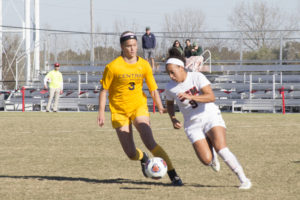 PHOTO BY STEVEN SPEARS/MANAGING EDITOR Redshirt sophomore Jada Scott (9) had five shots and one goal in the game against the Bronchos. 